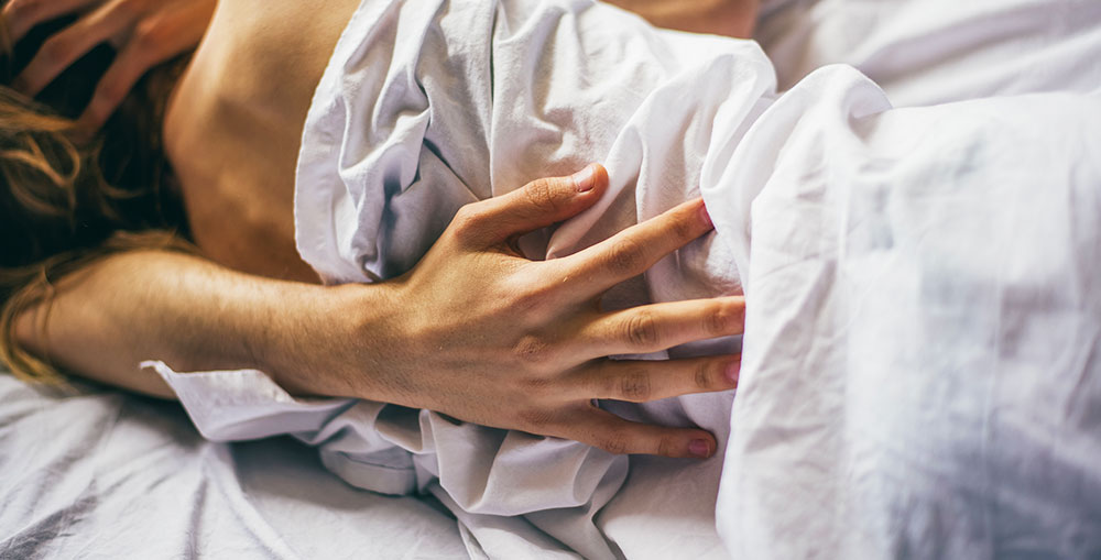 Happy couple enjoying the profound health and relationship benefits of sleeping next to each other