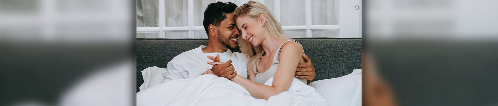 Couple enjoying the health benefits of sleeping next to someone