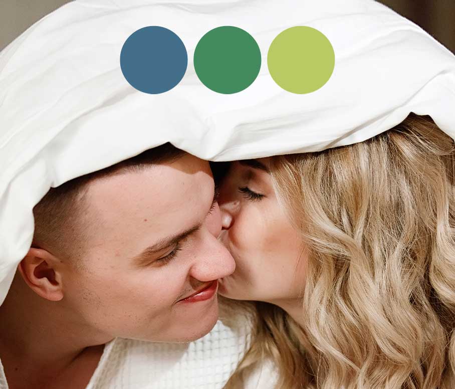 Couple in love kissing under duvet with three duvets logo.