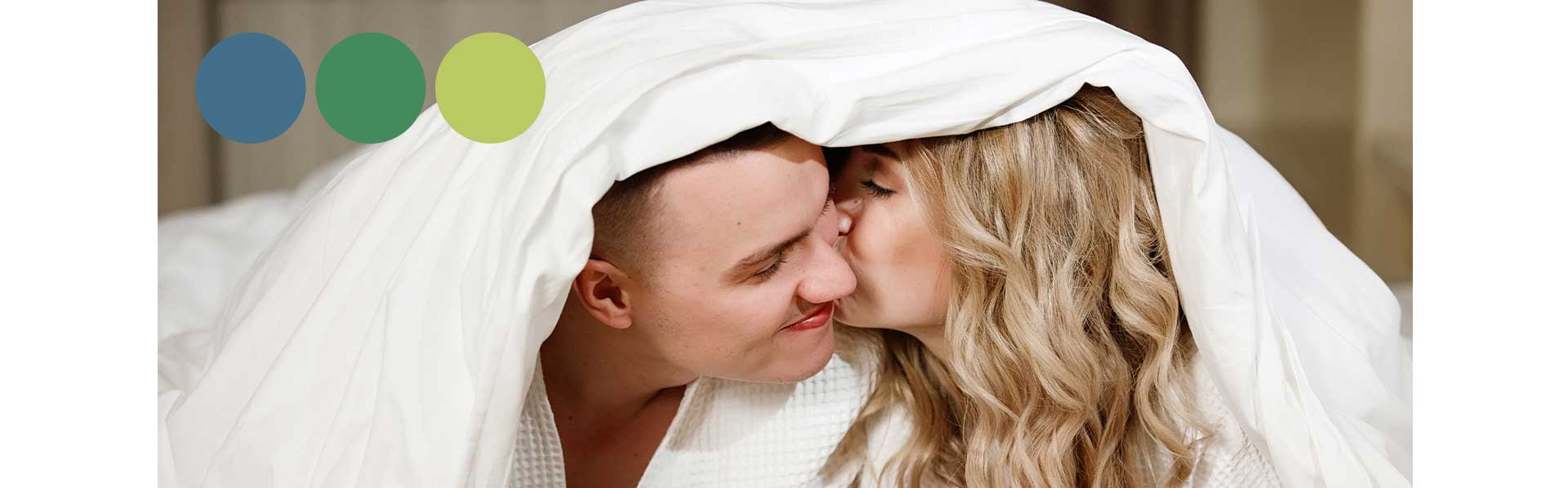 Couple in love kissing under duvet with three duvets logo.
